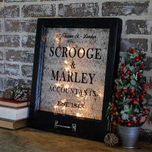 Scrooge & Marley themed window art
